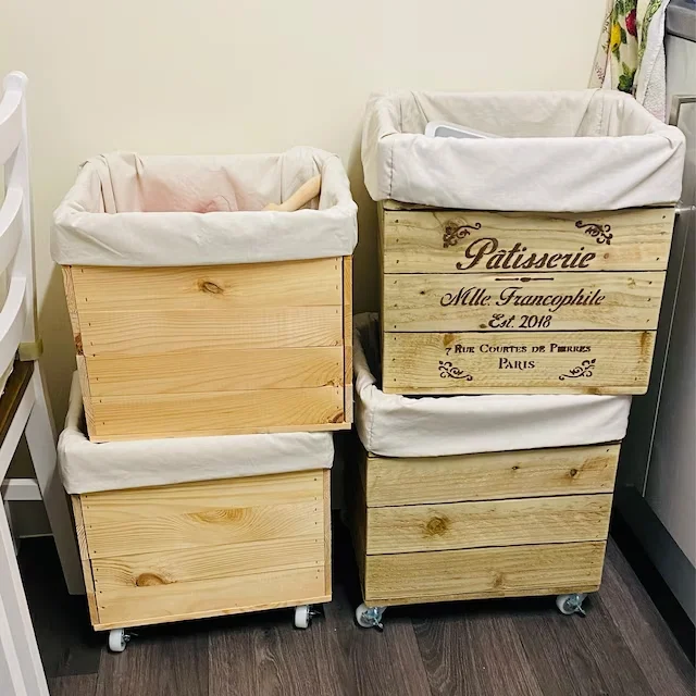 Light wooden crates with fabric inserts for storing clothes