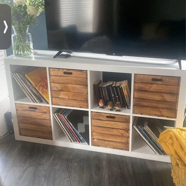 Wooden crates as KALLAX boxes in a white cube shelf
